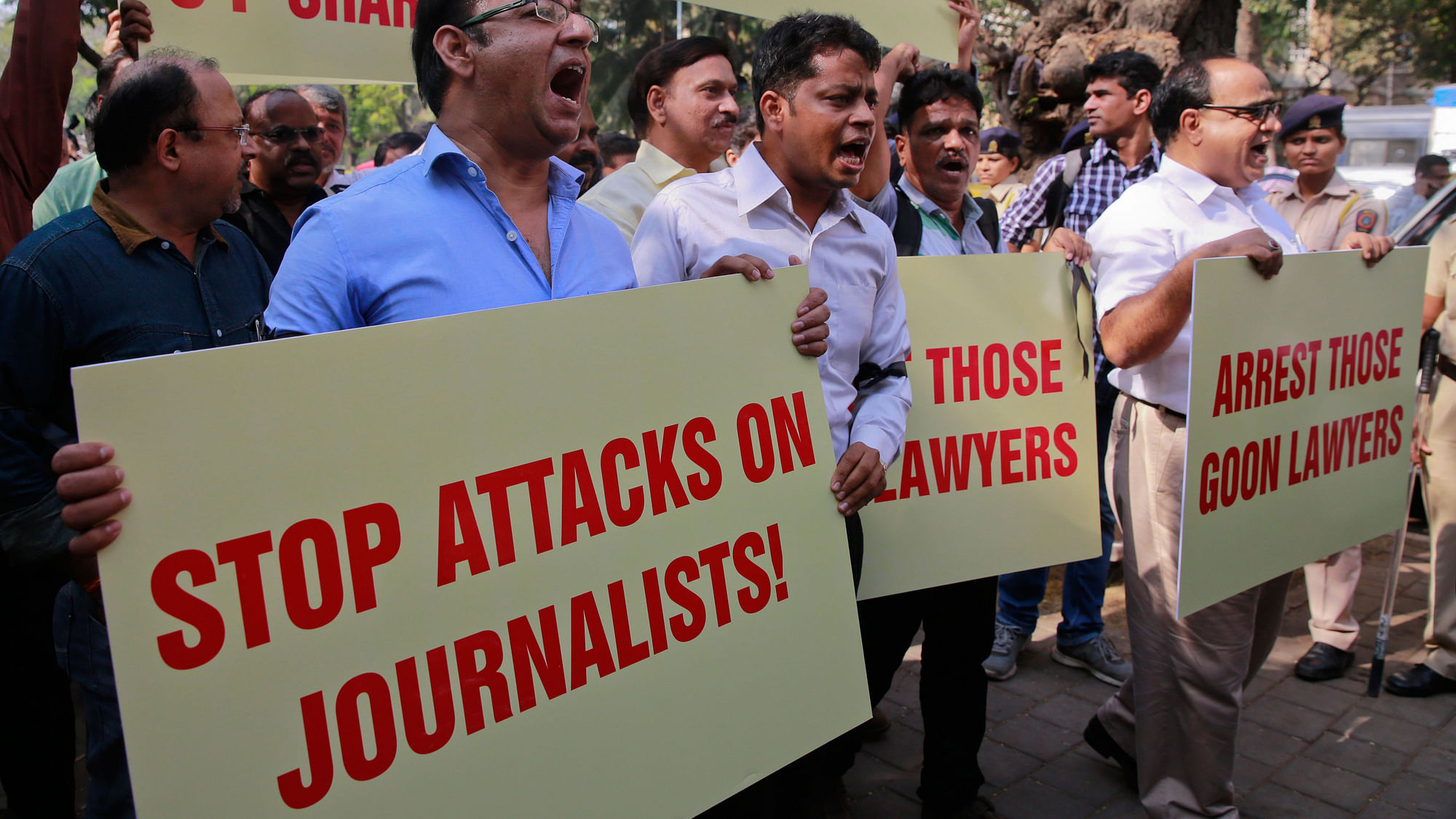Journalists hold placards during a protest against attack on journalists in Mumbai, February 2016. (Photo: AP)