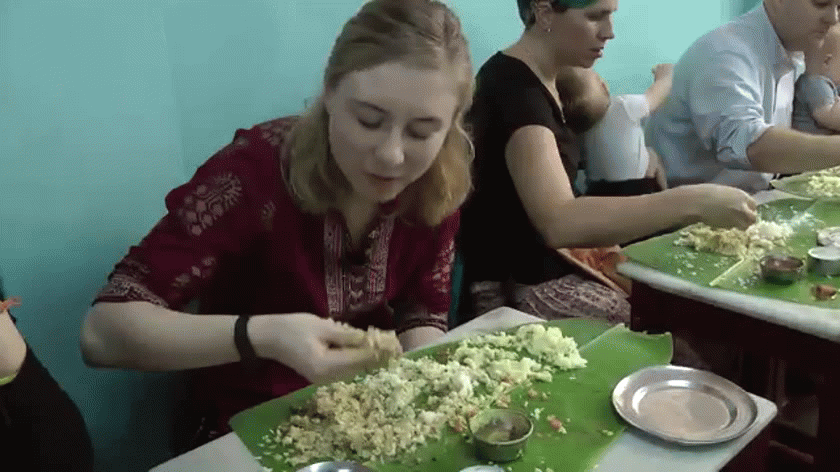 These Americans discover the best way to enjoy a traditional south Indian meal in Chennai.