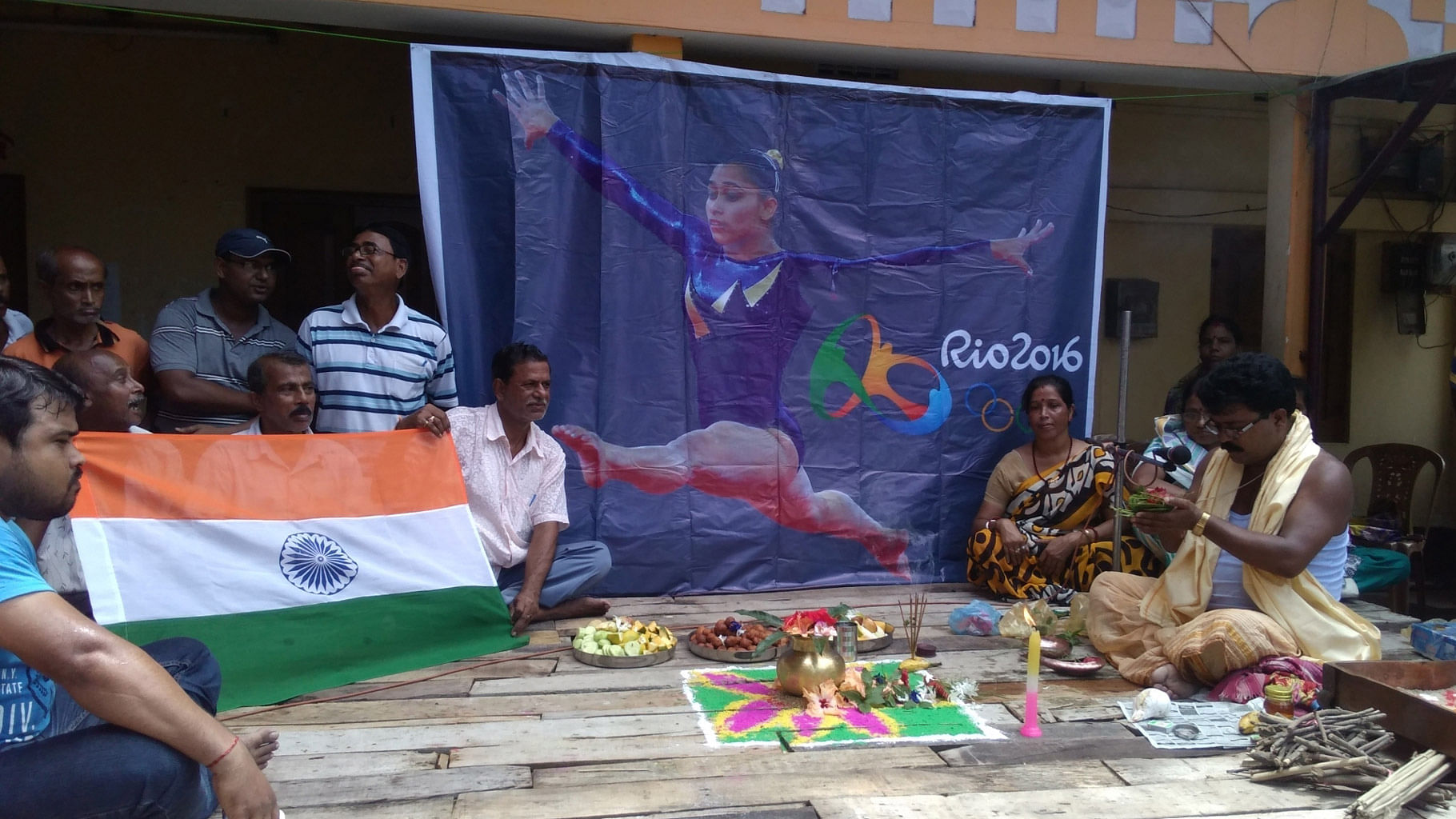 

People offer prayers for Indian gymnast Dipa Karmakar who came fourth in Women’s vault at Rio 2016 Olympics, in Agartala, 14 August, 2016. (Photo: IANS)