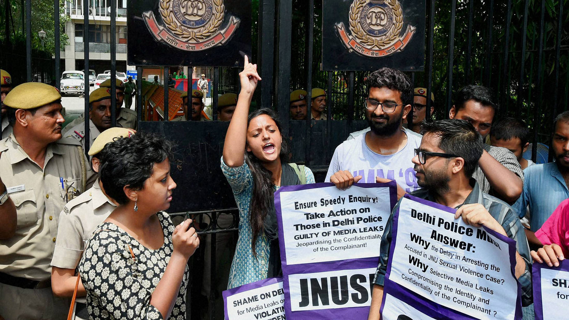  Members of AISA and JNUSU shout slogans during their protest in connection of JNU rape case at Police Headquarters in New Delhi on Thursday. (Photo: PTI)
