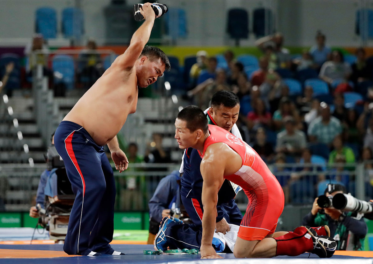 A Mongolian wrestler was penalised for dancing around his opponent in the last 18 seconds of their bout.
