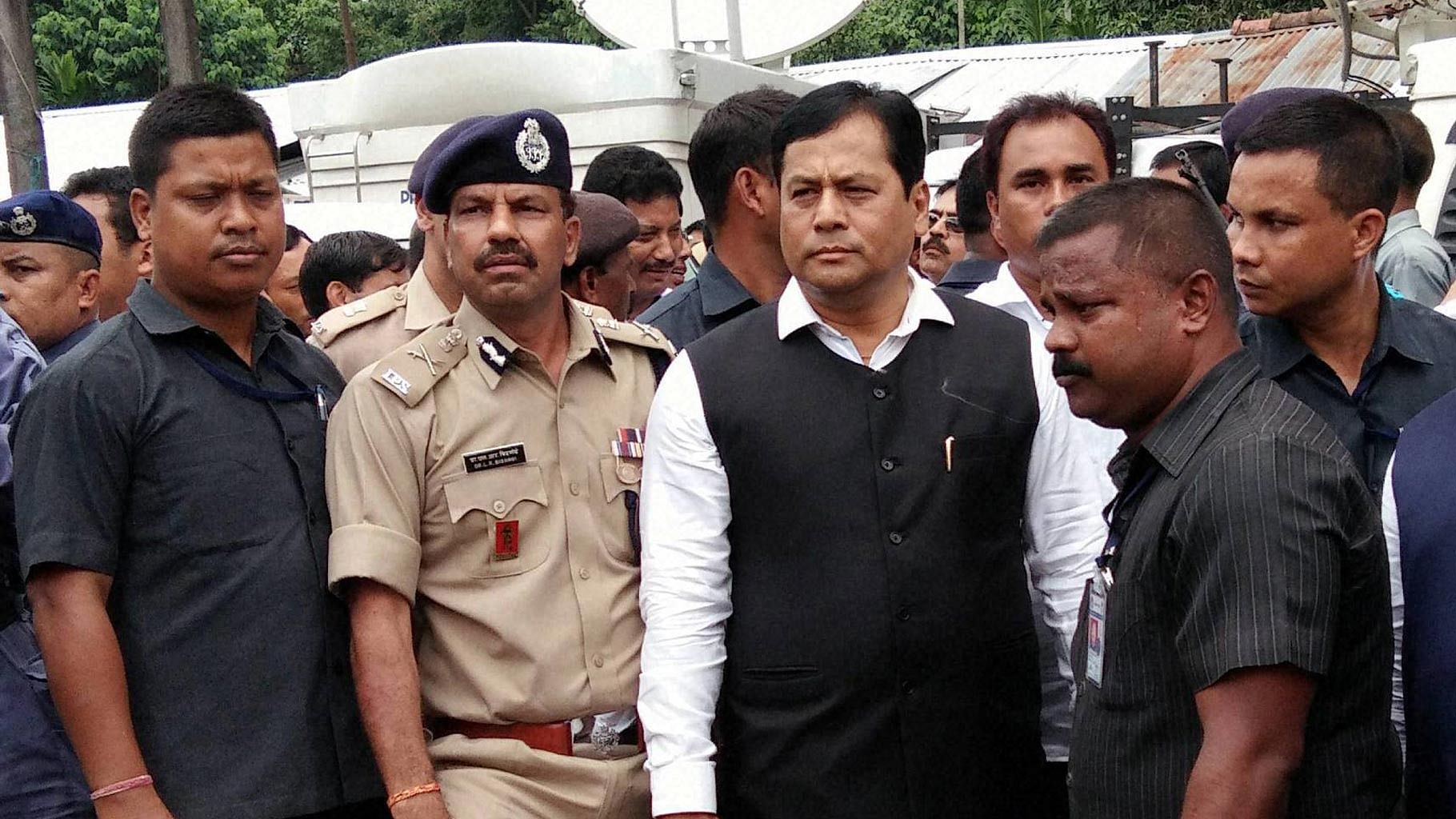 Assam Chief Minister Sarbananda Sonowal inspects the Balajan Tinali market that was attacked by NDFB (S) militant, in Kokrajhar district of Assam on Sunday, 7 August 2016. (Photo: PTI)