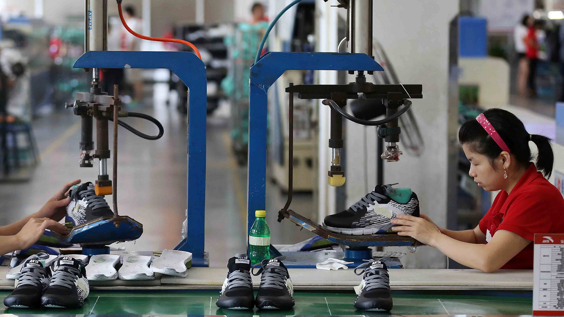 Workers assemble sneaker at a factory in Jinjiang city in southeast China’s Fujian province. (Photo: AP)