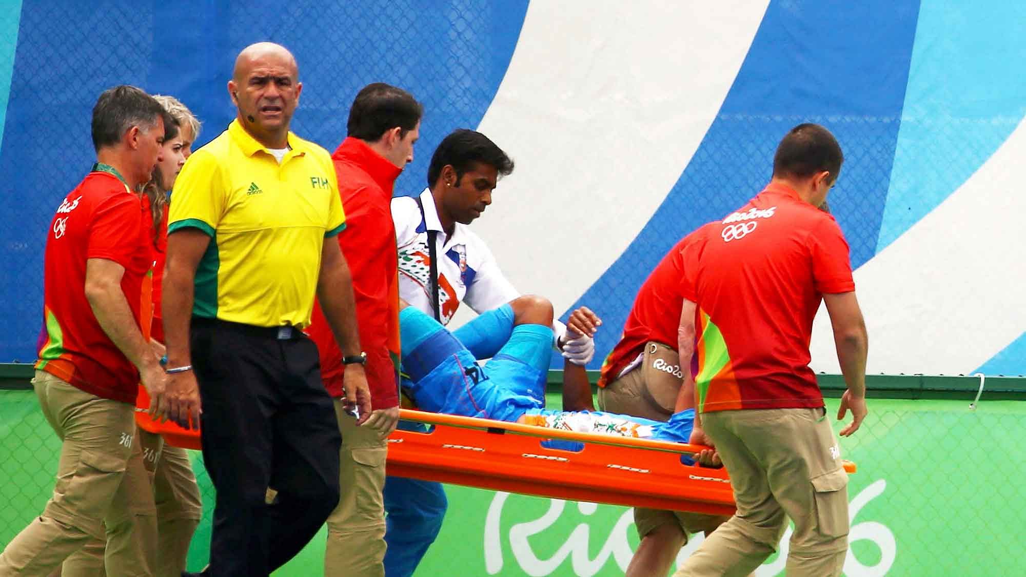 SV Sunil being stretchered off after sustaining an injury during the team’s final Group B fixture against Canada. (Photo: Reuters)