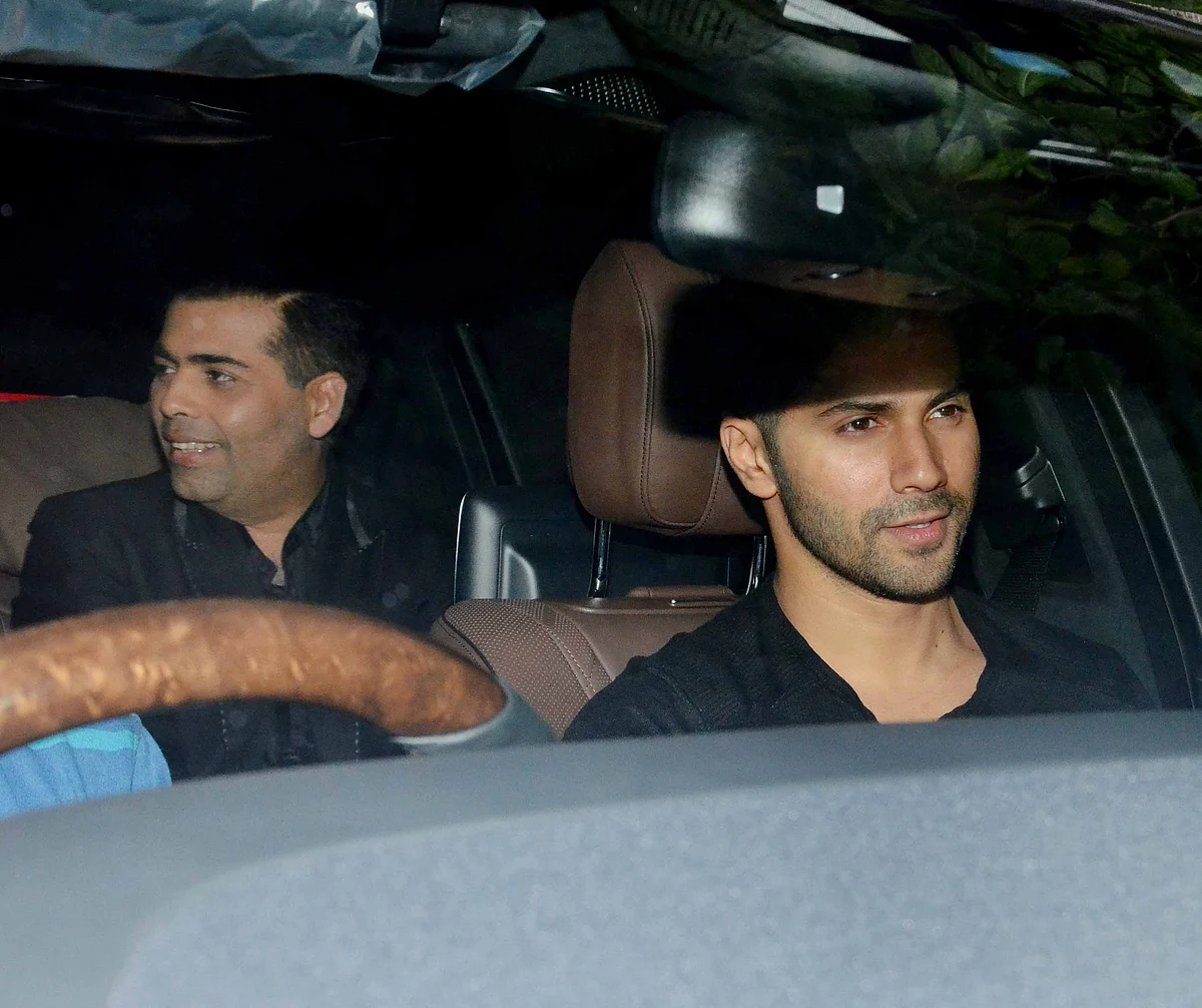 Varun Dhawan and Karan Johar arrive for the party. (Photo: Yogen Shah)