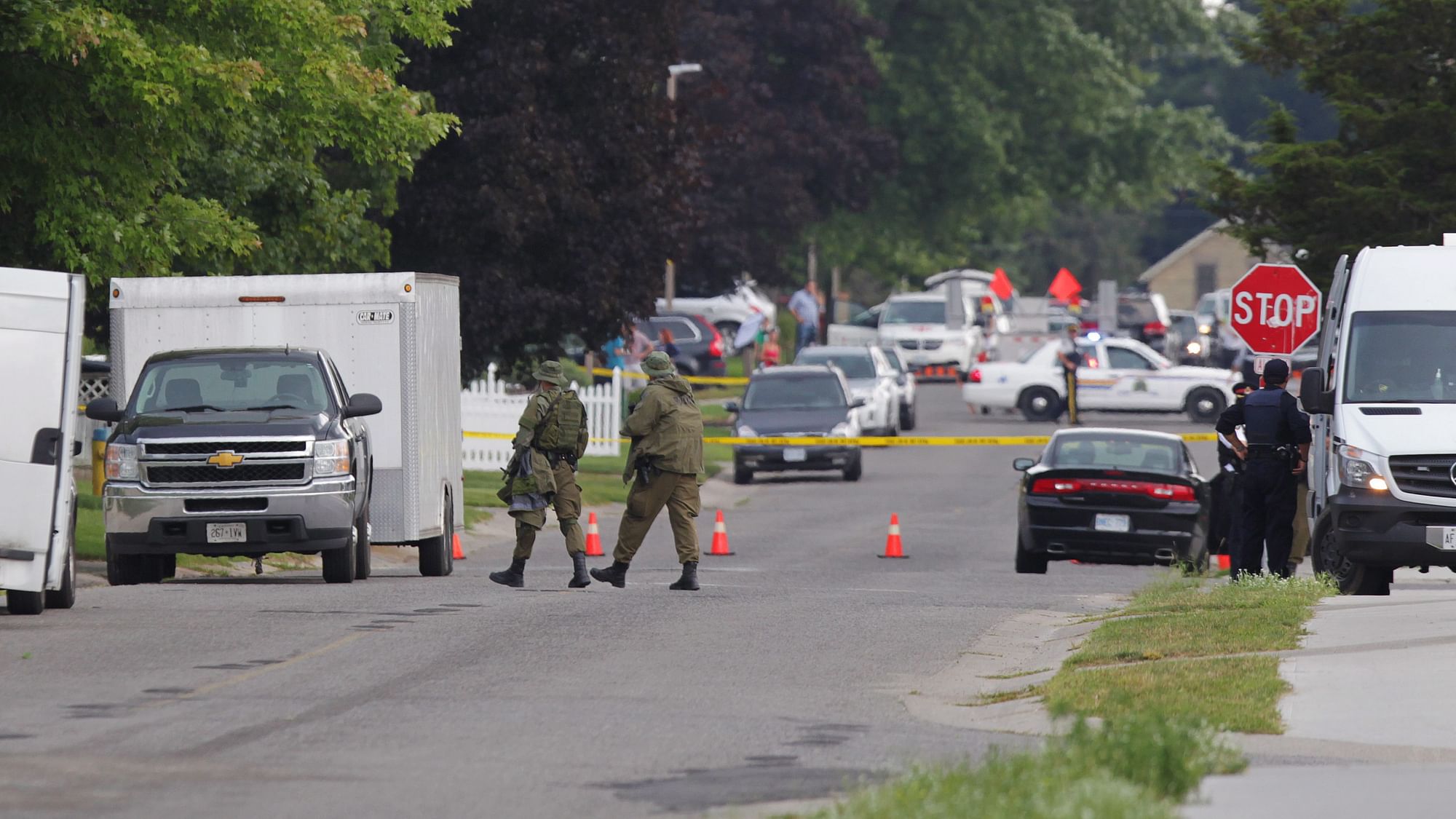 Police gather evidence outside of a house, a day after a stand-off with authorities in Ontario, Canada. (Photo: Reuters)
