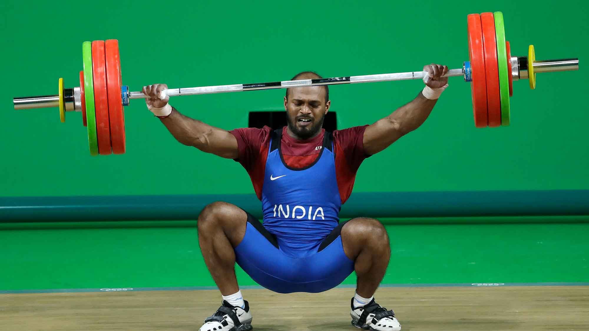 Sathish Kumar Sivalingam, of India, falls during the men’s 77kg weightlifting competition at the 2016 Summer Olympics in Rio de Janeiro, Brazil, Wednesday, Aug. 10, 2016. (AP Photo/Mike Groll)