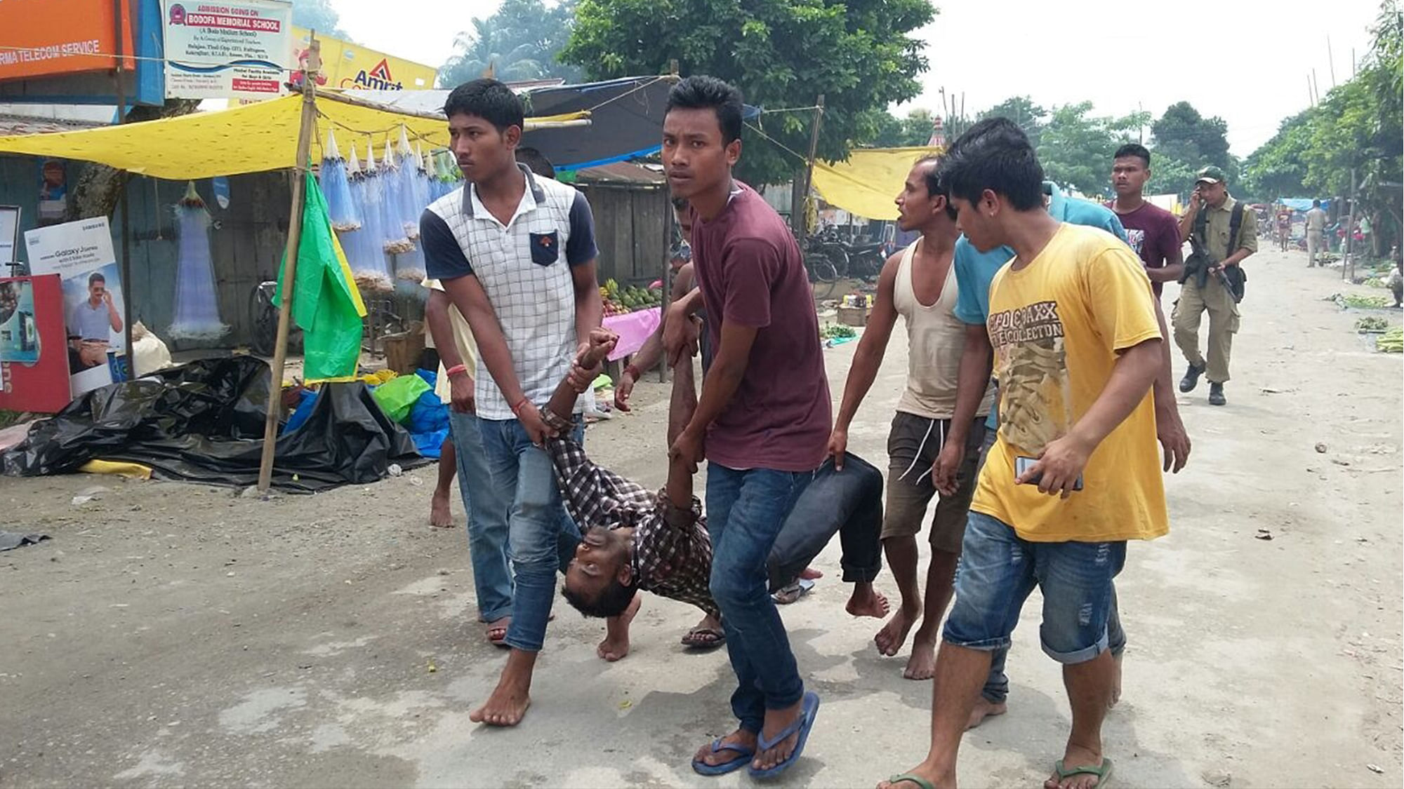 At least 12 civilians were killed on Friday when militants in military fatigues opened random fire at a busy market in Assam’s Kokrajhar town. (Photo: IANS)