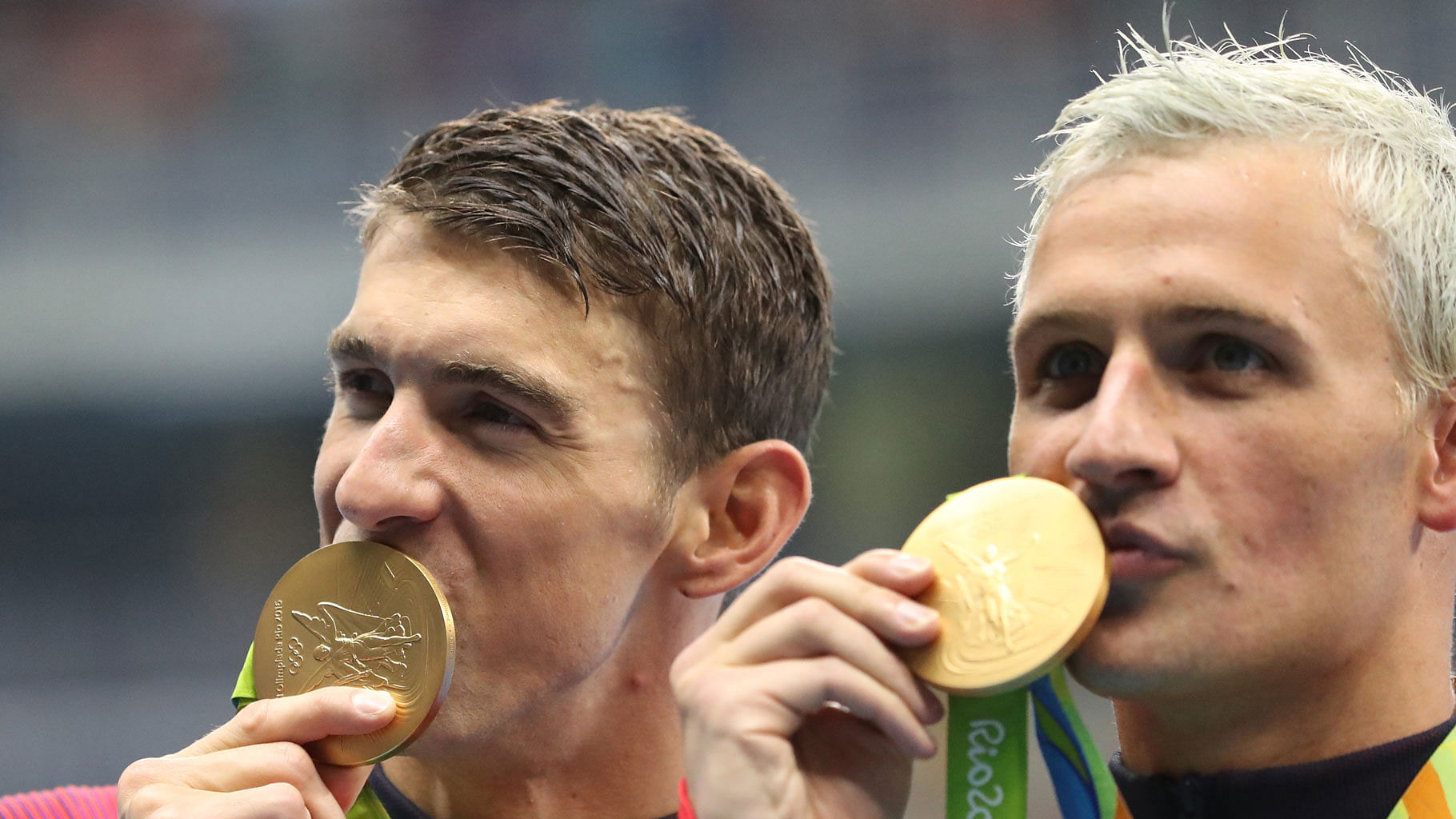 Armed robbers posing as police officers held a gun to the forehead of US gold medallist swimmer Ryan Lochte and his swimming teammates.&nbsp;(Photo: AP)