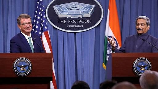 US Defence Secretary Ash Carter listens at left as Indian Defense Minister Manohar Parrikar speaks during their joint news conference at the Pentagon on Monday. (Photo: AP)