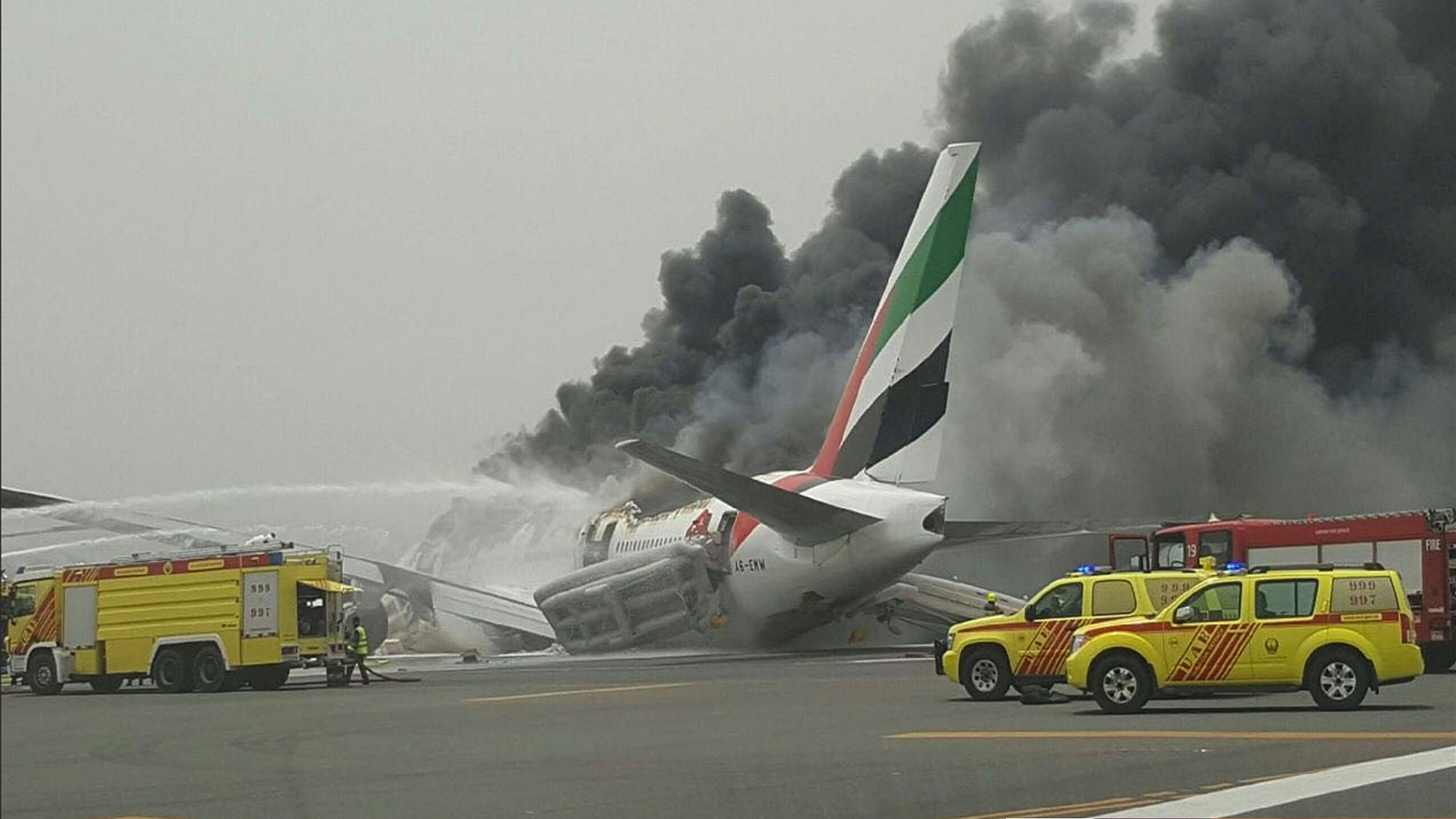 Smoke rising after an Emirates flight from Thiruvananthapuram crash landed at Dubai International Airport on Wednesday. (Photo: Twitter.com/shukla_tarun)