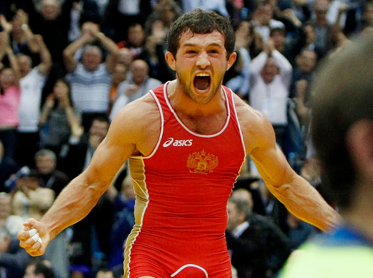 Besik Kudukhov of Russia celebrates his victory over Vasyl Fedoryshyn of Ukraine in their 60kg men’s freestyle gold medal match at the World Wrestling Championships in Moscow in 2010. (Photo: Reuters)