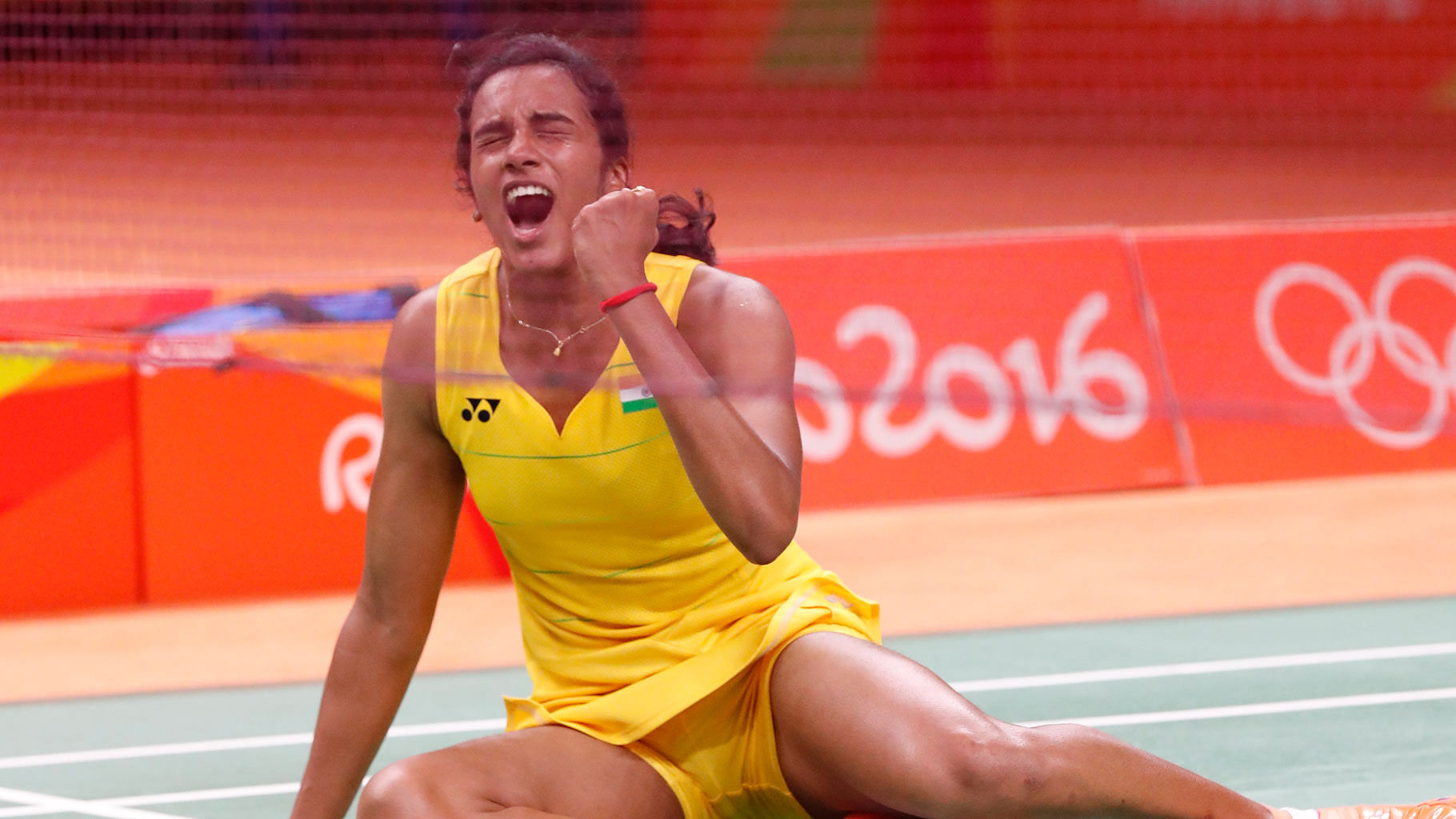 India’s PV Sindhu reacts after winning the final point against Wang Yihan of China in the quarterfinal match of women singles in badminton. (Photo: AP)