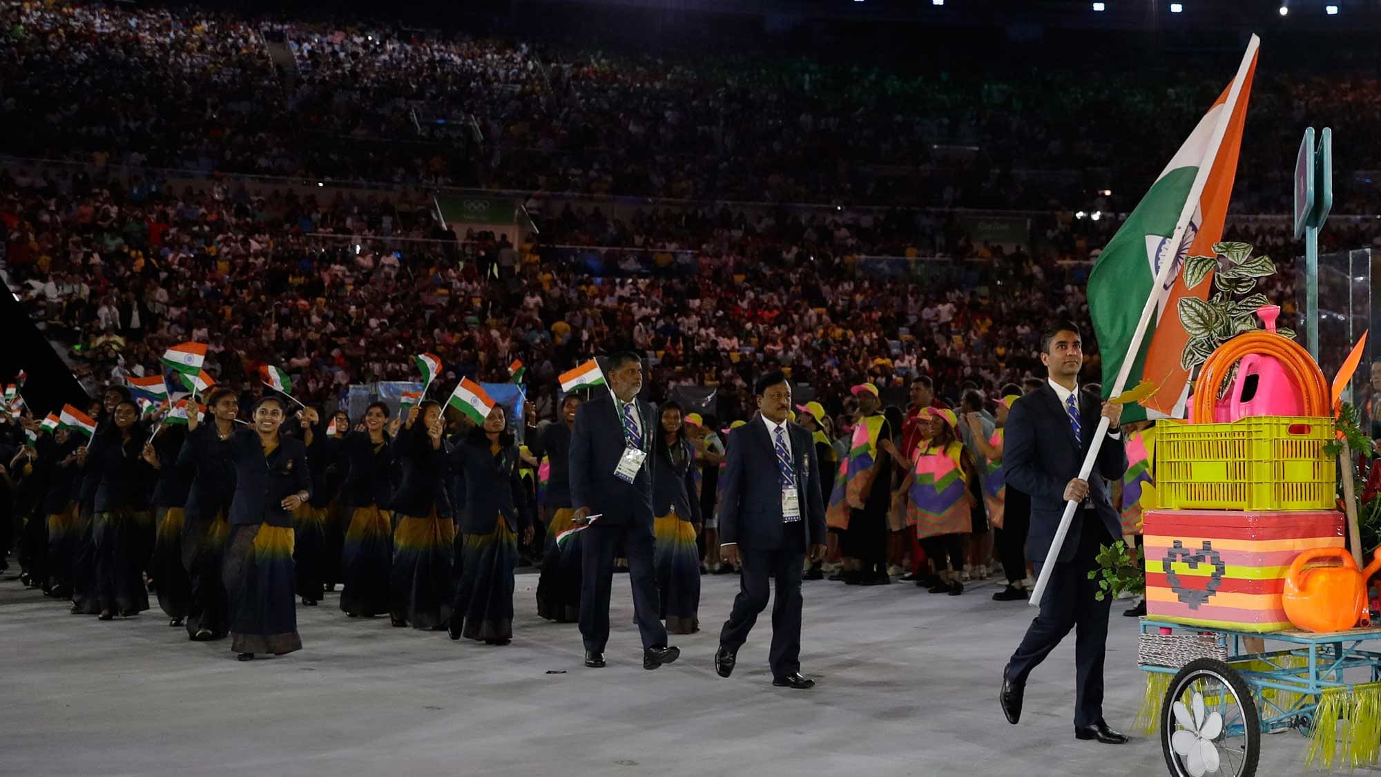 Abhinav Bindra carries the flag of India during the opening ceremony for the 2016 Summer Olympics in Rio de Janeiro, Brazil, Friday, Aug. 5, 2016. (AP Photo/Patrick Semansky)