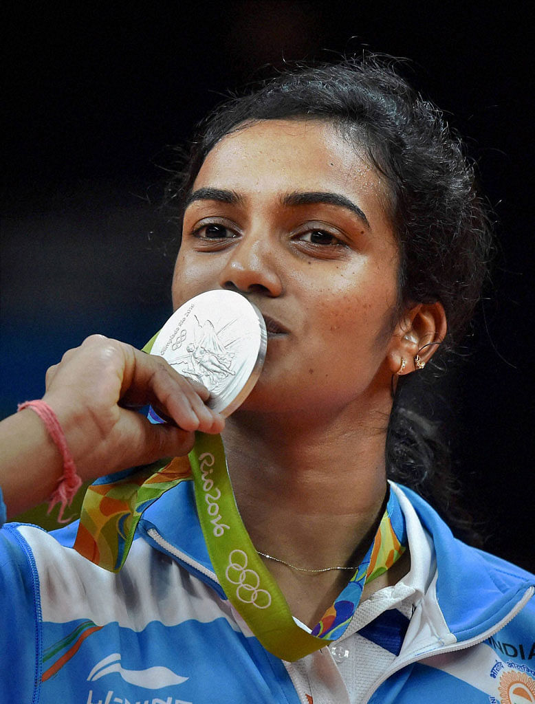 Badminton Association of India will award Rs 50 lack to PV Sindhu and Rs 10 lakh to her coach, Pullella Gopichand.