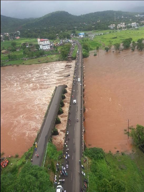 At least 30 people are feared missing as two state buses and ten vehicles are suspected to have fallen in the river.