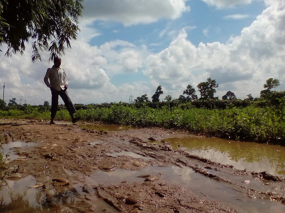 Sukhdeo Pradhan braves the monsoon and floods to come teach his students. (Photo Courtesy: Anjana Dutta)