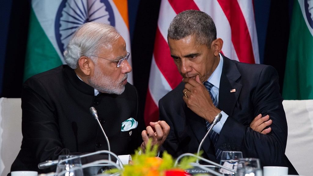 Modi and Obama have a private conversation at the Paris conference on climate change. (Photo: AP)