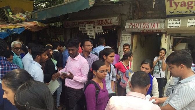 Students outside a photocopy shop in Delhi University. (Photo: <b>The Quint</b>)