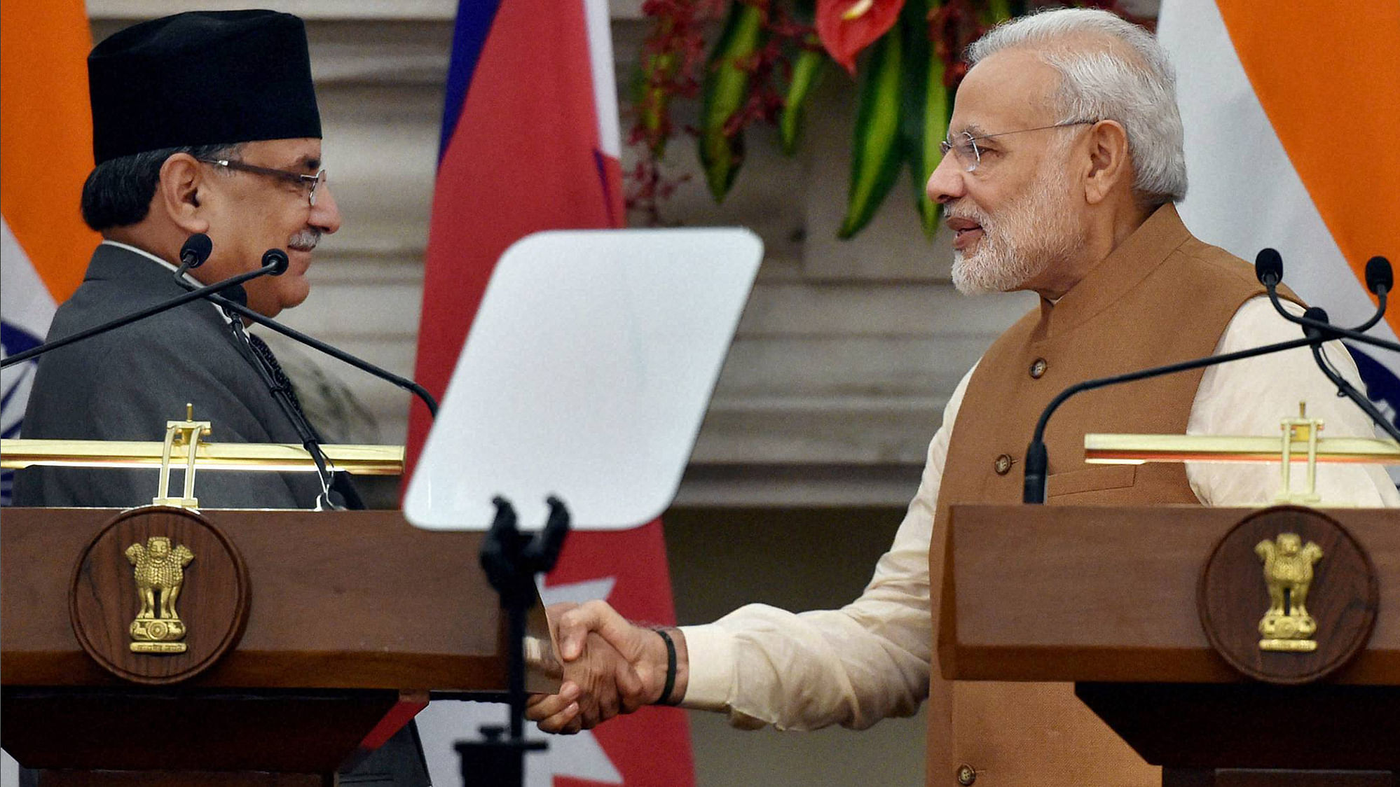 Prime Minister Narendra Modi and his Nepalese counterpart Pushpa Kamal Dahal shake hands after a joint statement at Hyderabad house in New Delhi on Friday. (Photo: PTI)