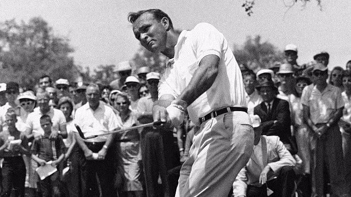 Arnold Palmer, lifts an iron shot from number five fairway in the final round of the Texas Open in San Antonio in 1962. (Photo: AP)
