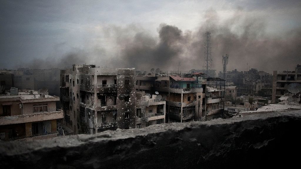 

In a 2012 file photo, smoke rises over Saif Al Dawla district, in Aleppo, Syria. (Photo: AP)