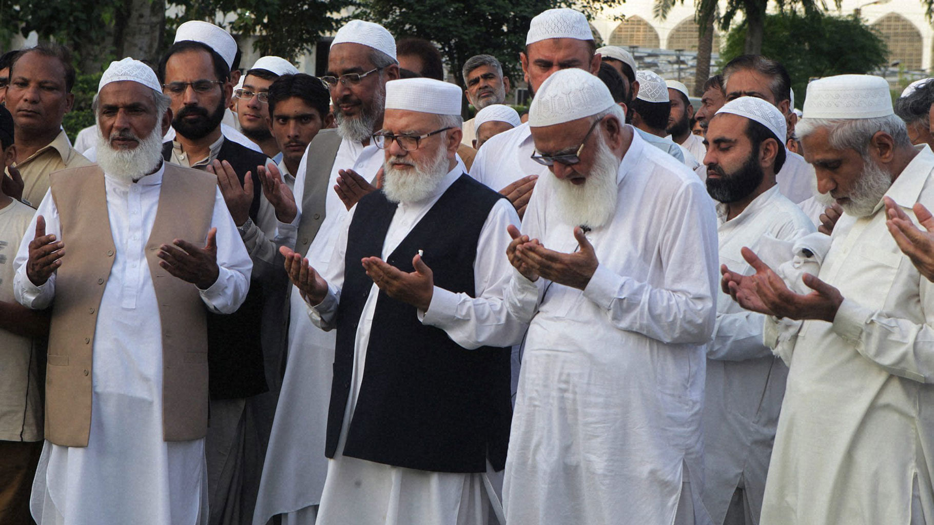 Supporters and Pakistani leaders of Jamaat-e-Islami  pray during a special prayers for Mir Quashem Ali, leader of the Bangladeshs largest Islamic party Jamaat-e-Islami. (Photo: PTI)