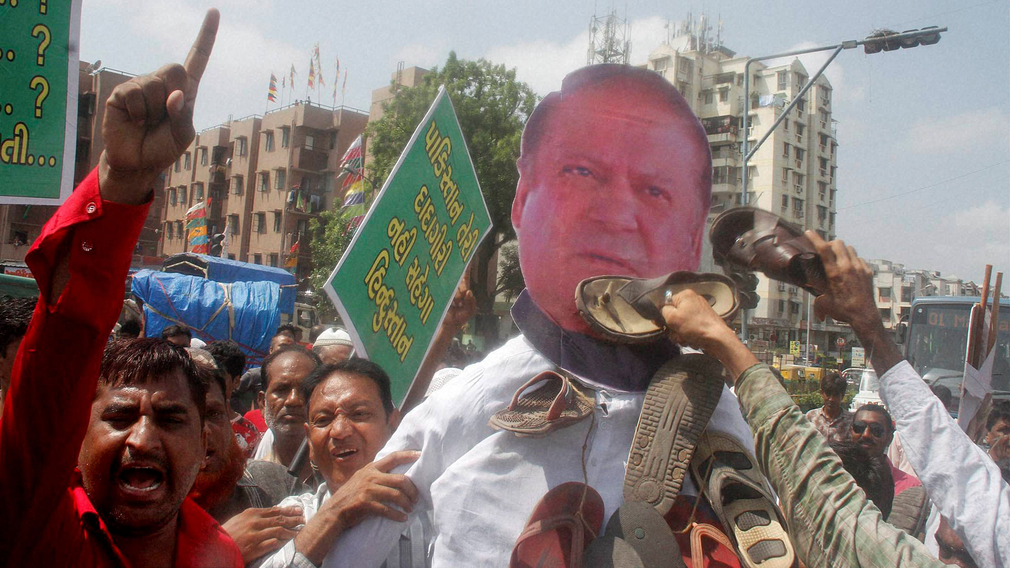 People beating an effigy of Pakistan Prime Minister Nawaz Sharif during a protest against the Uri attack, in Ahmedabad on Wednesday. (Photo: PTI)