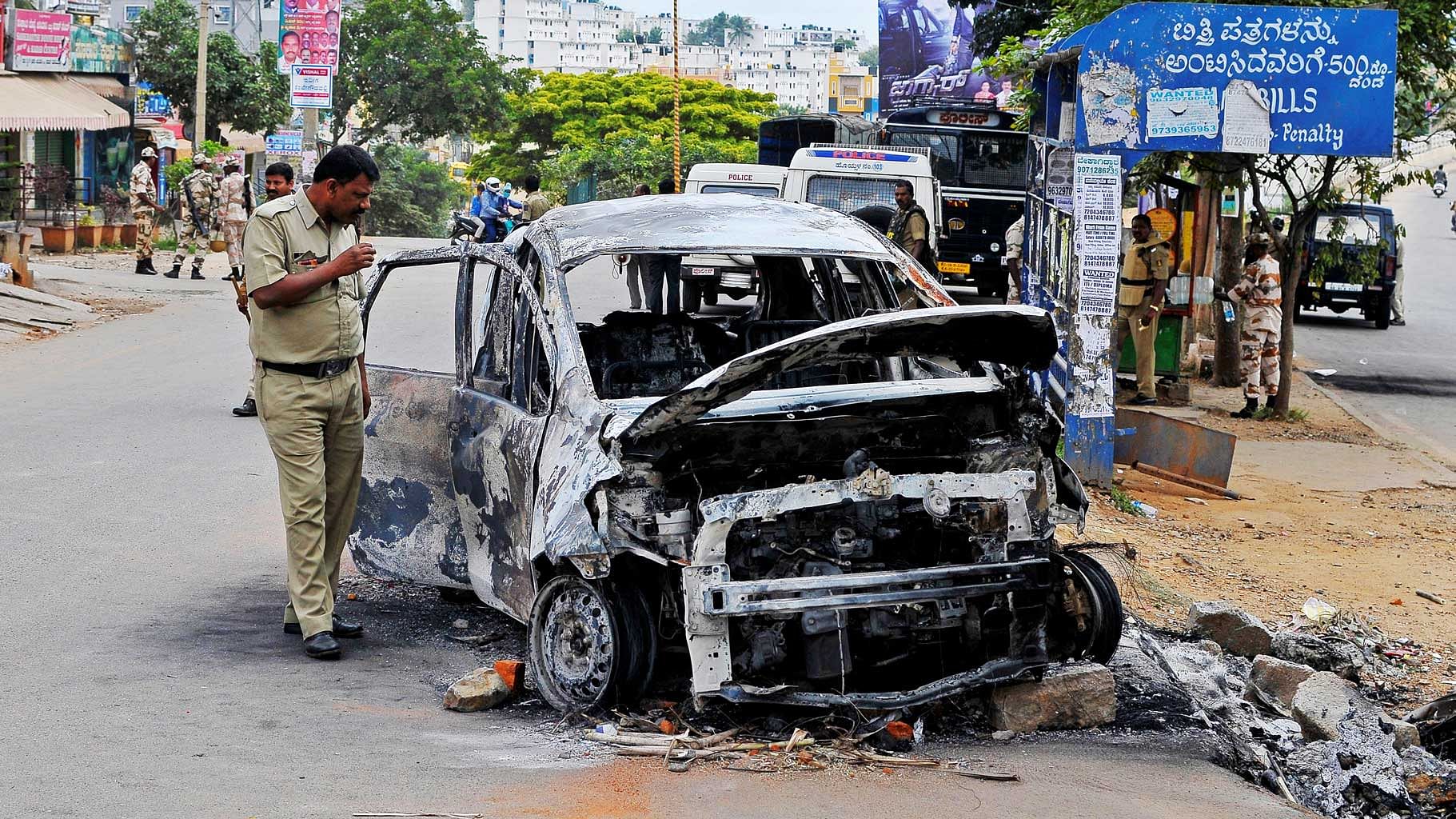 Protesters vandalize a bus stop and burned several vehicles in Bengaluru over the Cauvery dispute. (Photo: Reuters)