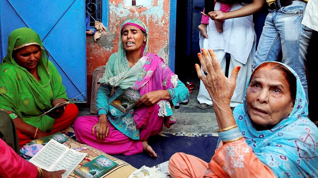 A file photo of Akhlaq’s relatives mourning his death  at his home. (Photo: PTI)