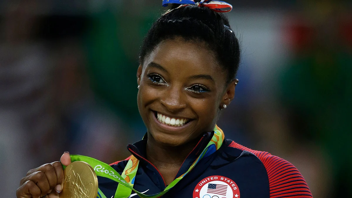 American Simone Biles smiles after receiving her gold medal at Rio Olympics. (Photo: AP)
