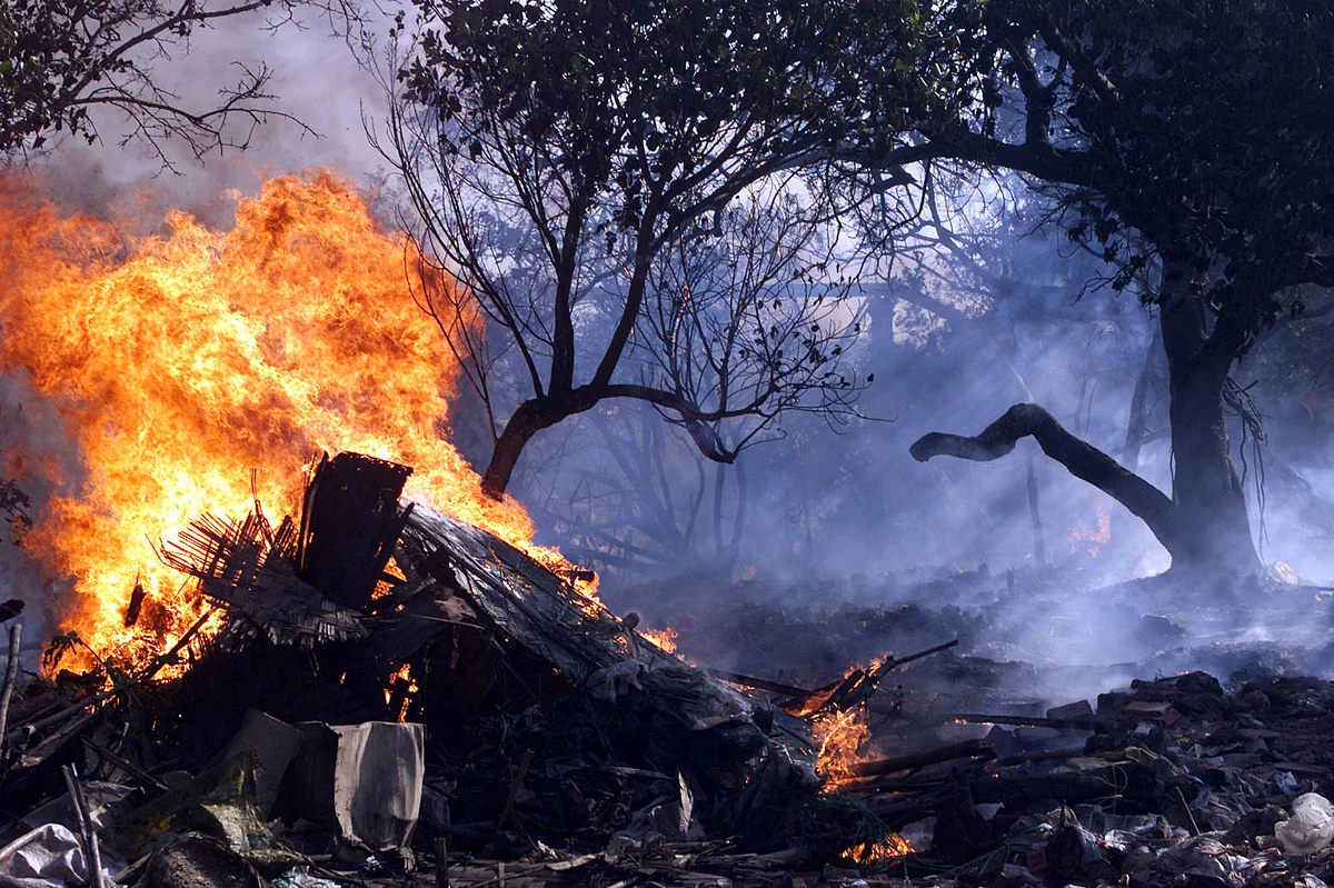 Flames envelop an unauthorised slum that was razed to the ground by
authorities as part of an eviction drive. (Photo: Reuters)