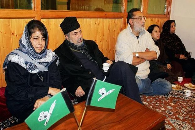 File photo Jammu and Kashmir Chief Minister Mehbooba Mufti with party leaders in Srinagar. (Photo: PTI)