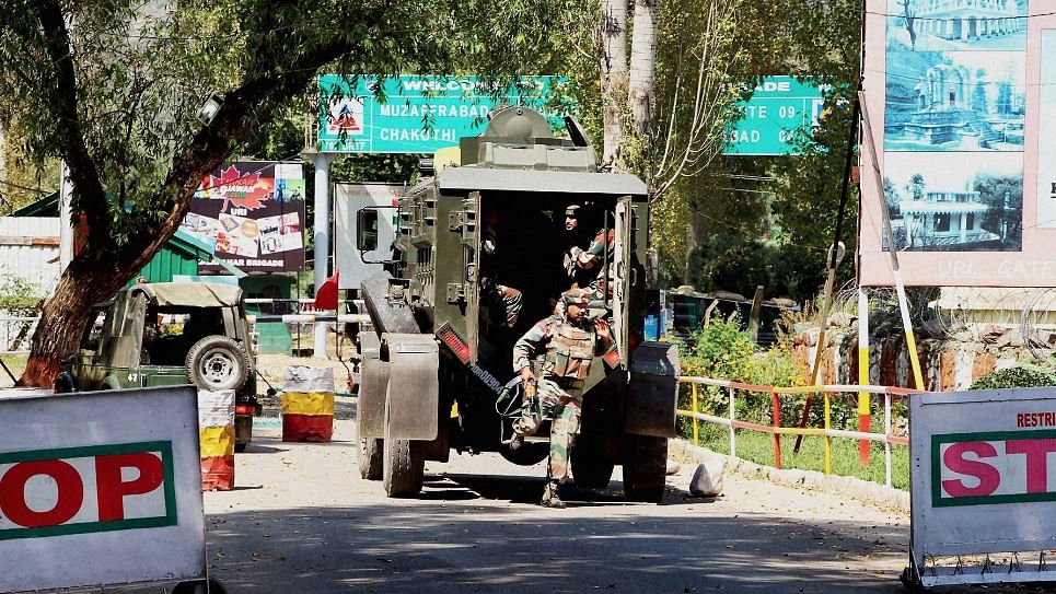 Army personnel in action inside  the army brigade camp during the Uri attack. (Photo: PTI)
