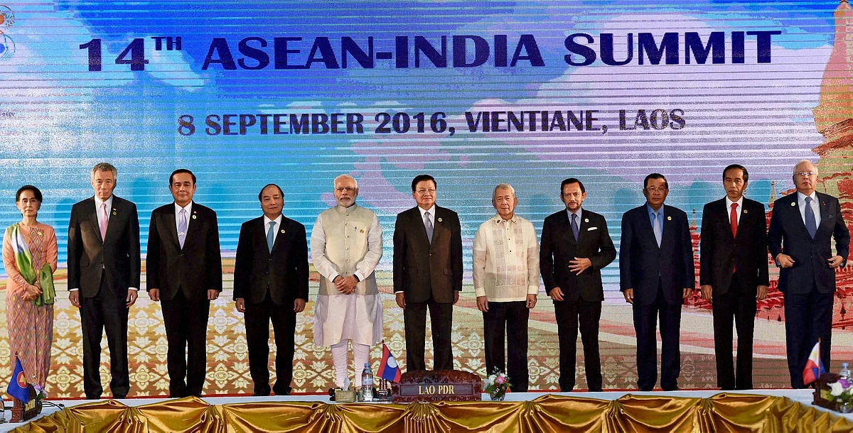 Prime Minister Narendra Modi posing for a group photo at the 14 ASEAN summit in Laos. (Photo: PTI)
