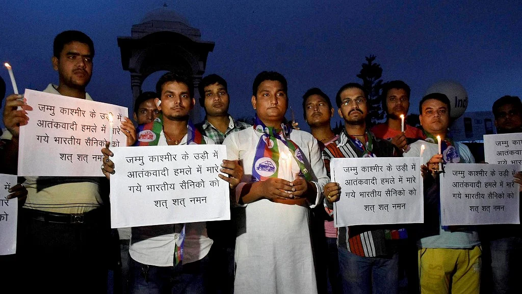 Lok Janshakti party activists during a candle light vigil to pray for soldiers killed in the terror attack in Uri near the Line of Control, in Patna on Sunday. (Photo: PTI)