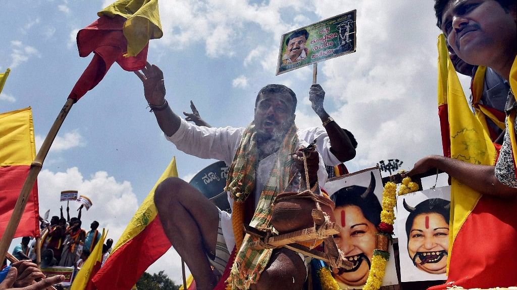 Protesters destroy posters of Tamil Nadu Chief Minister J Jayalalithaa. (Photo: PTI)