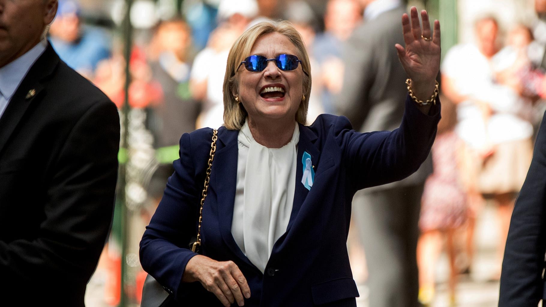 Democratic presidential candidate Hillary Clinton waves after leaving an apartment building on Sunday. (Photo: AP)