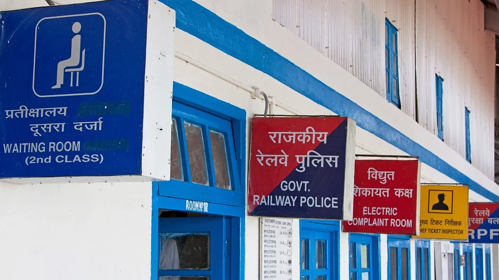 Variety of bilingual signs on the platform of the Shimla railway station. 