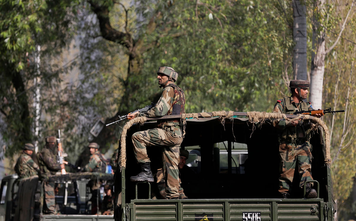 Indian soldiers guard outside the army base which was attacked on Sunday by suspected militants at Uri,  Kashmir. (Photo: AP)