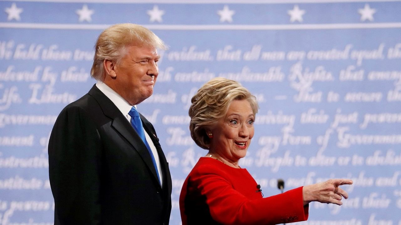 

Republican US presidential nominee Donald Trump and Democratic US presidential nominee Hillary Clinton look on at the start of their first presidential debate at Hofstra University in Hempstead, New York. (Photo: Reuters)