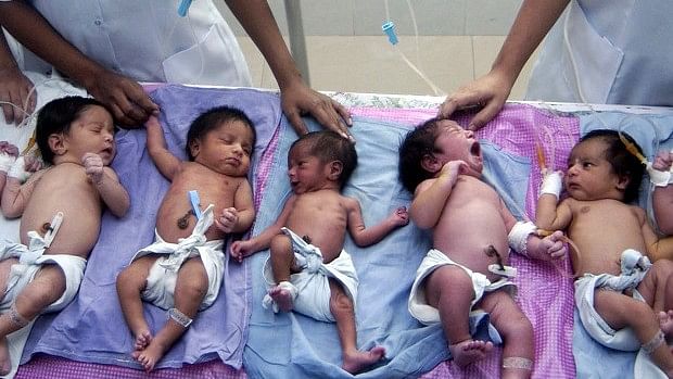 Newly born babies lie in the paediatric ward of a hospital on the occasion of the World Population Day in Lucknow, Uttar Pradesh.