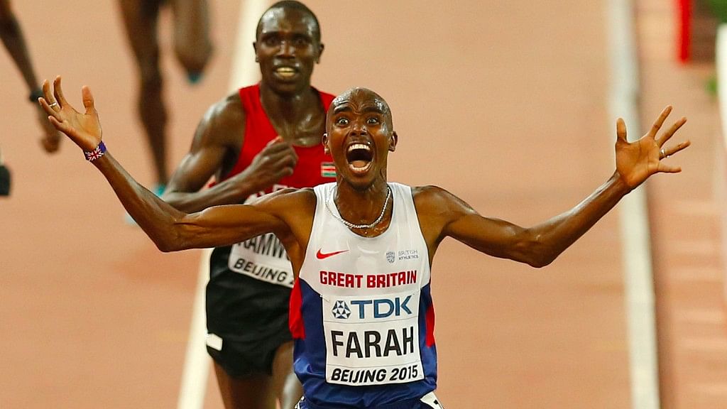 Britain’s Mo Farah celebrates after winning the gold medal in the men’s 10,000 m final at the World Athletics Championships. (Photo: AP)
