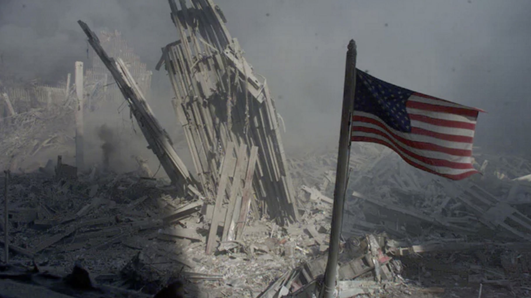 <div class="paragraphs"><p>An American flag flies near the base of the destroyed World Trade Center in New York. </p></div>