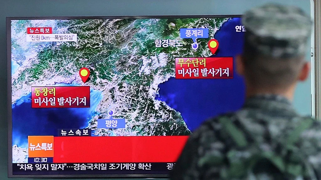 A South Korean marine watches a TV screen reporting about North Korea’s possible nuclear test at the Seoul Railway Station in Seoul, South Korea. (Photo: AP)