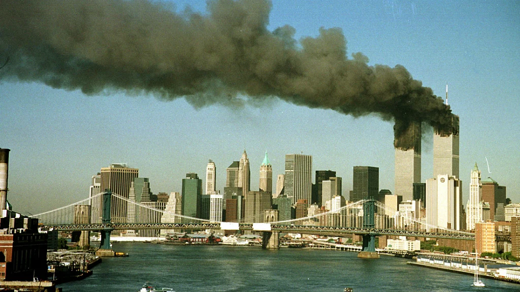 The towers of New York’s World Trade Centre pour smoke shortly after being struck by hijacked commercial aircraft on 11 September, 2001. (Photo: Reuters)