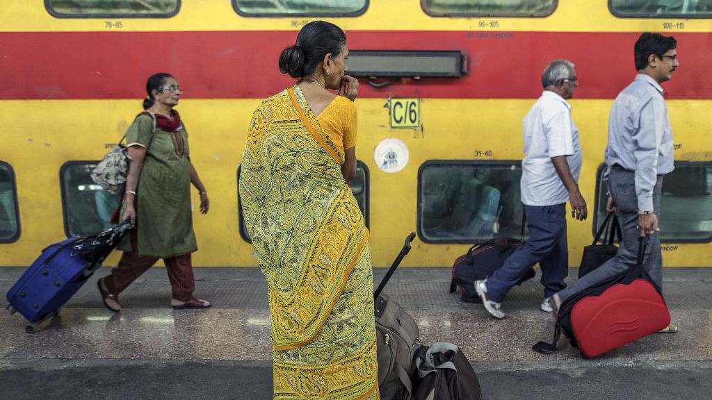 

Passengers walk along the platform at the Mumbai Central Station. (Photo: Bloomberg Quint)