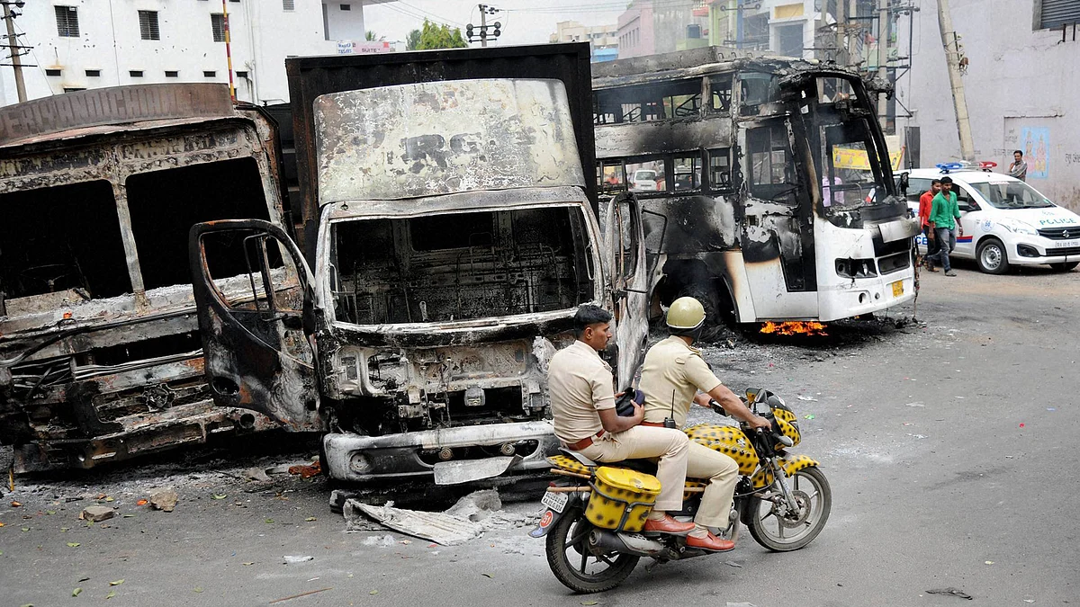 Charred remains of the vehicles in Bengaluru on Tuesday, a day after they were torched by pro-Kannada activists during their violent protests over Cauvery water row. (Photo: PTI) 