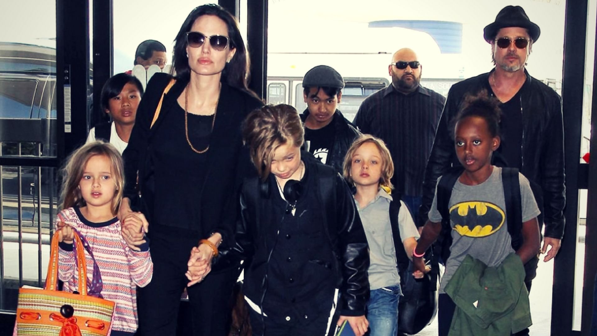 Angelina Jolie and Brad Pitt  with their six children in happier times.