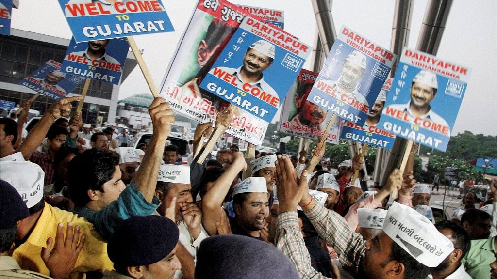 AAP supporters welcome party convener and Delhi CM Arvind Kejriwal at Sardar Patel Airport in Ahmedabad on Saturday, 15 October 2016. (Photo: PTI)